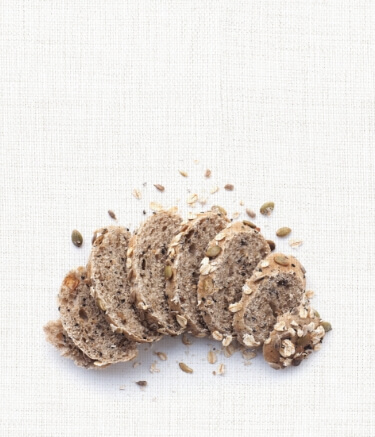 burlap gray background with seeded bread