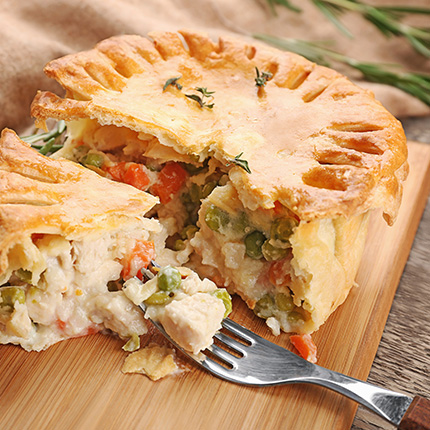 Chicken pot pie with a slice cut out