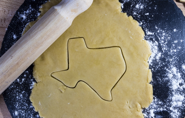 cookie cutter imprint of the state of texas in dough, where the founder of arrowhead mills, Frank Ford, is from.