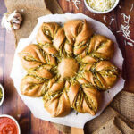 bread with pesto swirled into the dough, baked in the shape of a star with 8 points