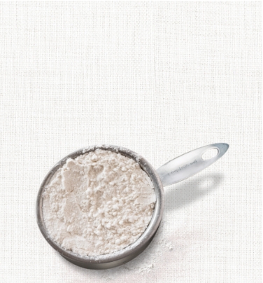 scoop of flour on a burlap background